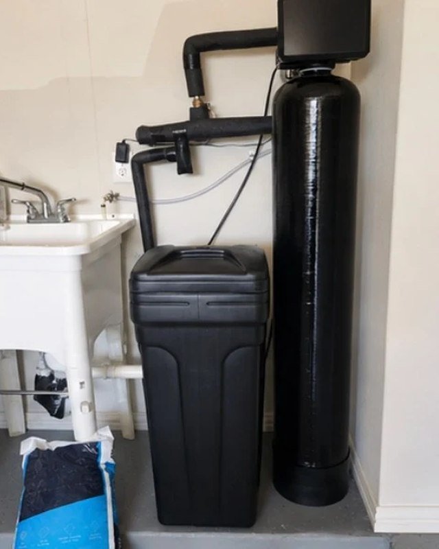 Water softener and filtration system installed in a home